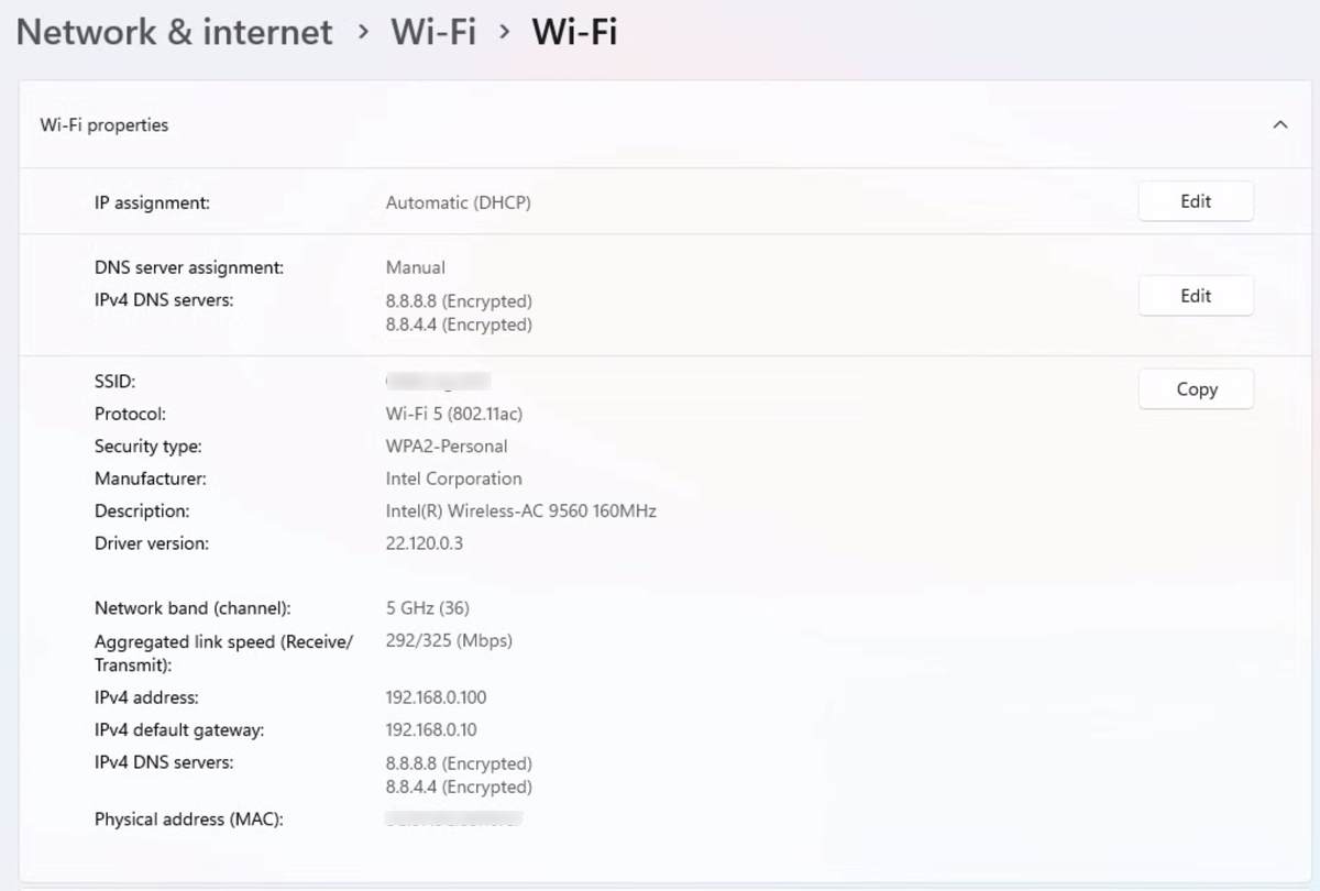 Windows 11 Wi-Fi properties after the change, showing DNS server assignment Manual and both IPv4 DNS servers labelled Encrypted